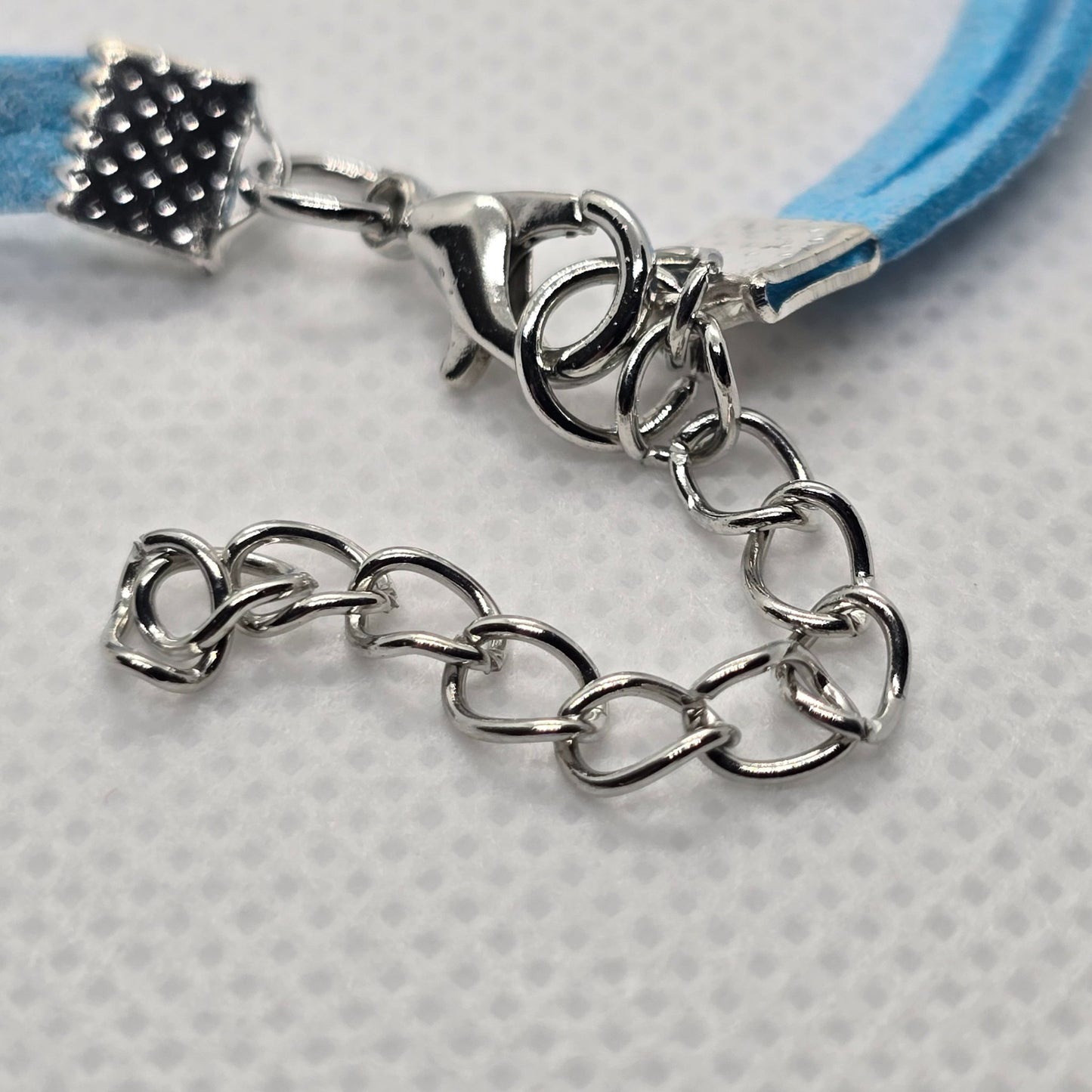 Close-up image of the adjustable clasp on the Infinite Love for Turtles bracelet, showcasing its durable silver chain design.