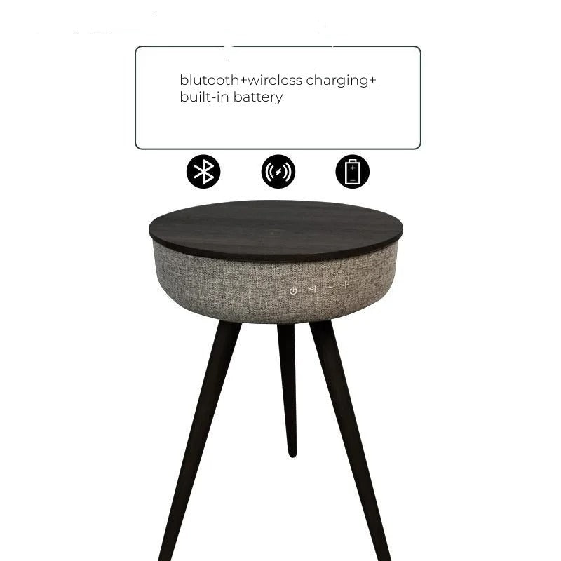 Black smart coffee table with Bluetooth speakers, wireless charging, and built-in battery