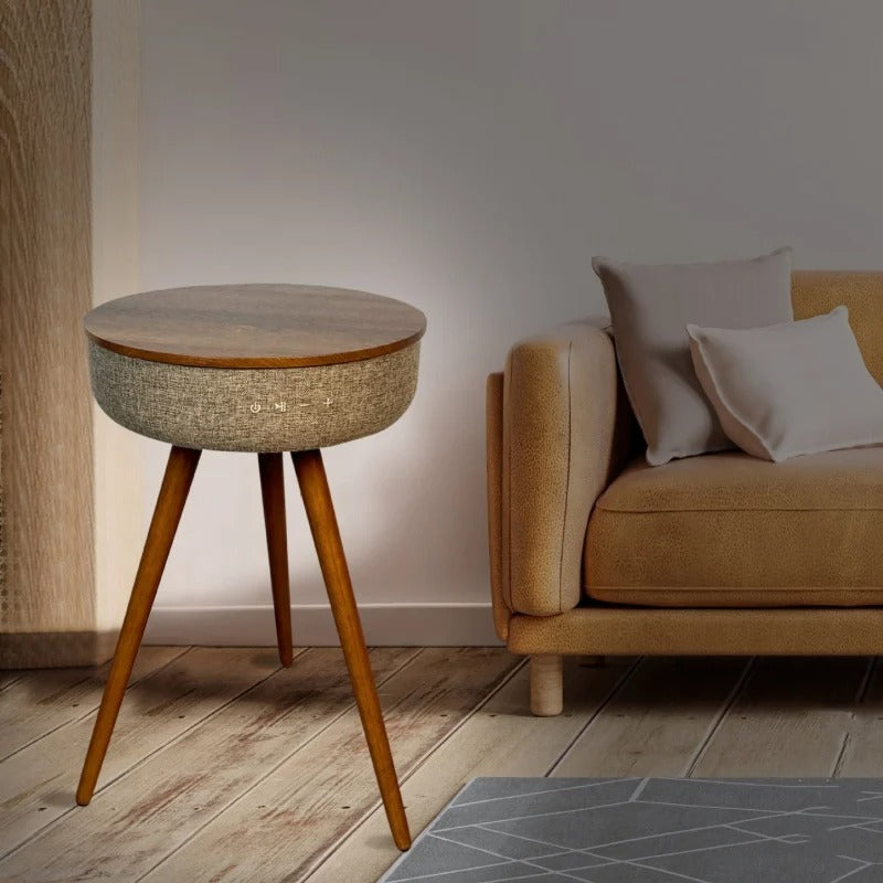 Modern smart coffee table placed next to a cozy sofa in a stylish home