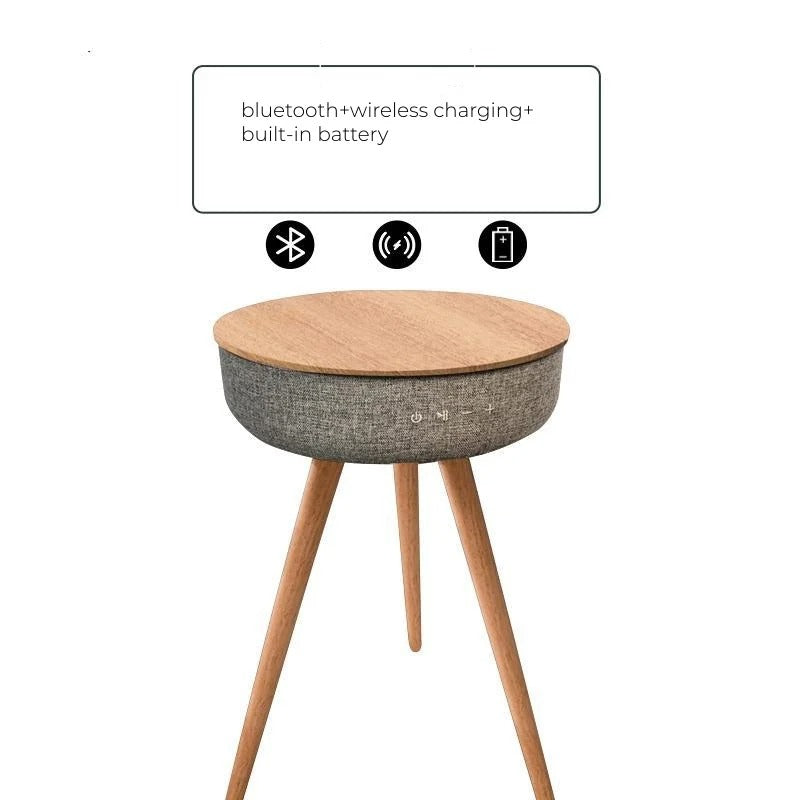 Natural wood smart coffee table featuring Bluetooth speakers, wireless charging, and a built-in battery