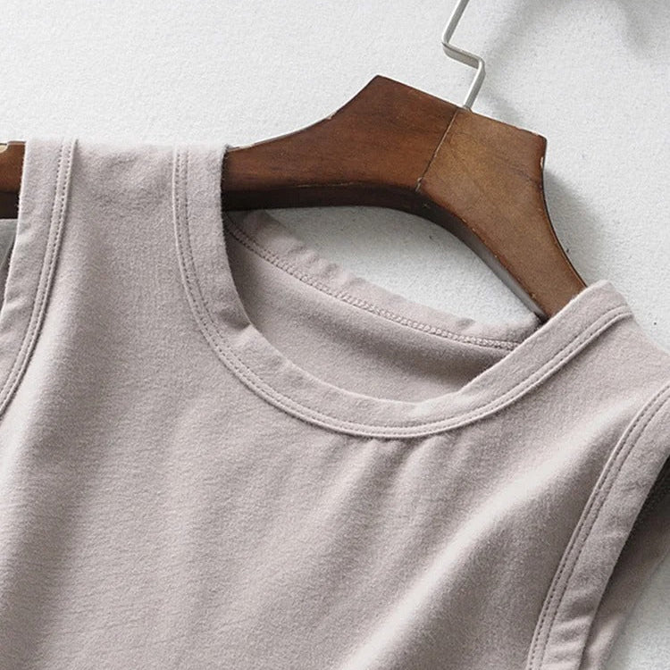 Front upper view of the vintage beige biker punk crop top on hanger