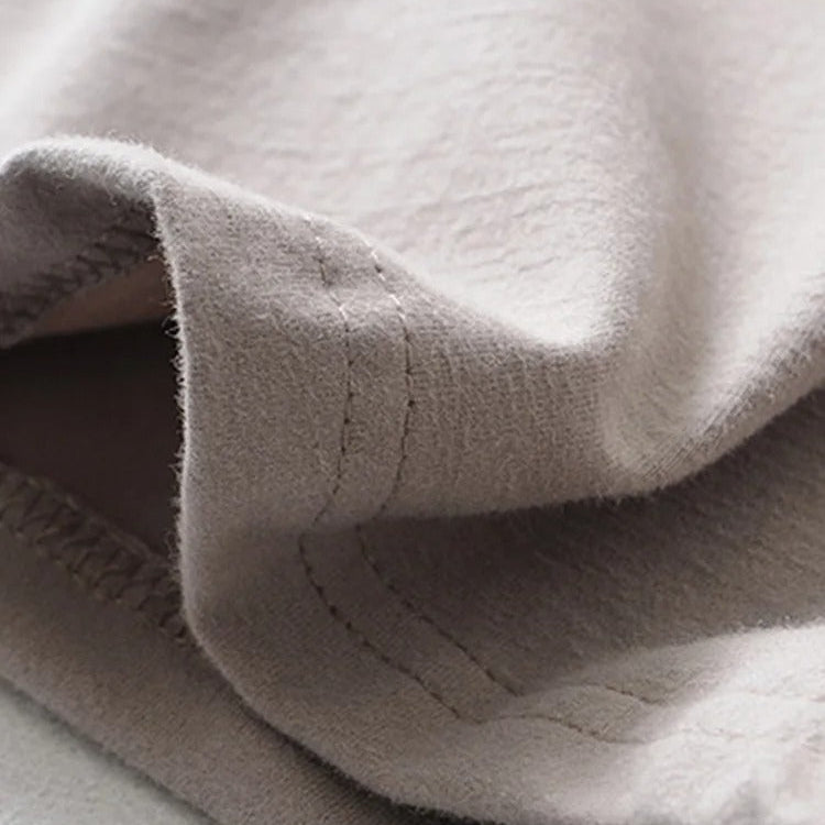 High-quality stitching detail of beige punk crop top fabric