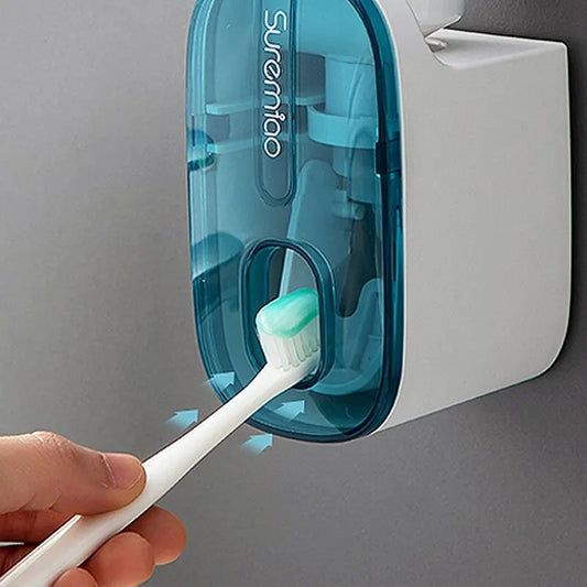 Toothbrush pressing against automatic toothpaste dispenser for hands-free toothpaste dispensing