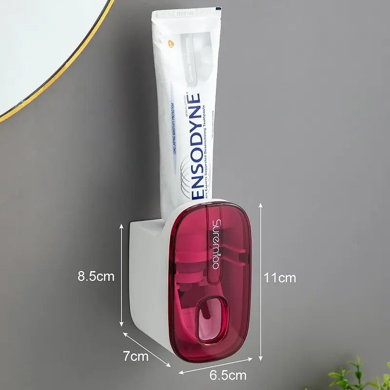 Purple automatic toothpaste dispenser showing product dimensions and wall-mounted design