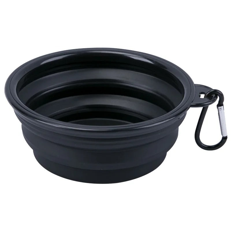 Black collapsible dog food or water bowl with carabiner clip, perfect for active pets.