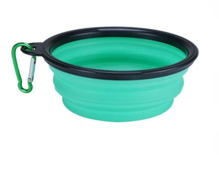 Light blue travel-friendly collapsible pet bowl with clip for feeding and hydration.