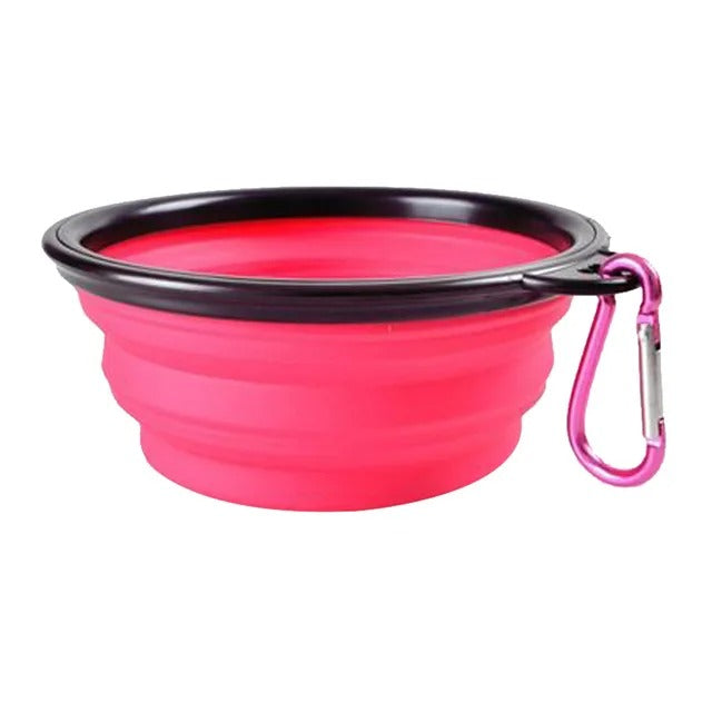 Pink foldable pet bowl with clip for travel, camping, and outdoor activities.