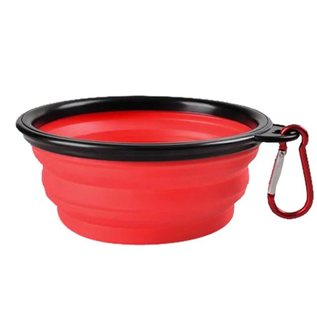 Red collapsible dog and cat food bowl with durable carabiner for easy transport.