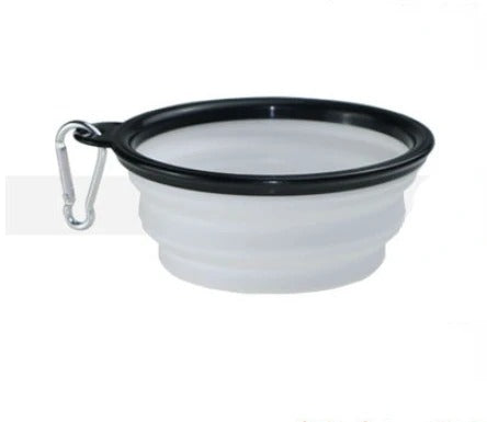 Portable and foldable pet food bowl in white with carabiner, ideal for on-the-go feeding.