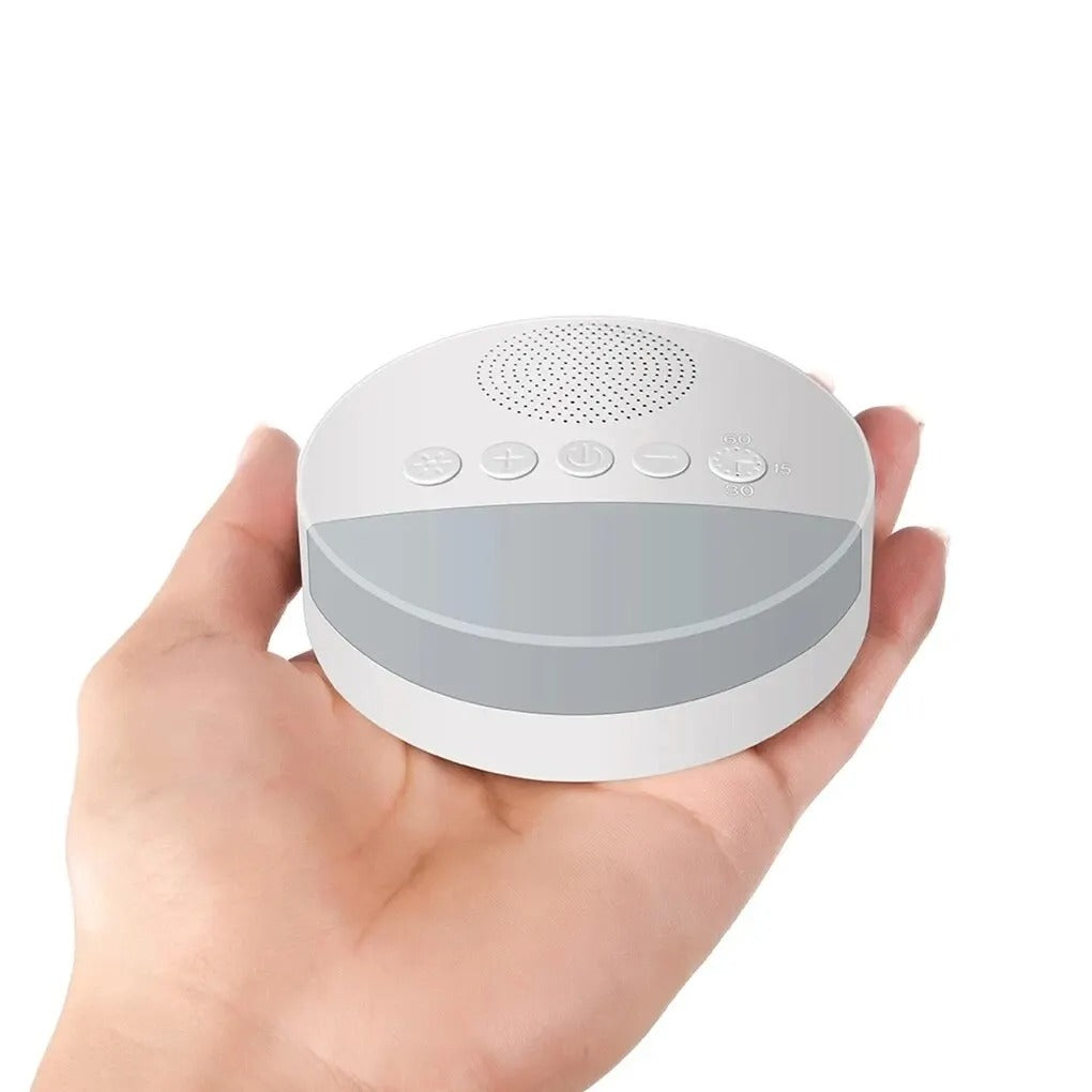 Compact, palm-sized white noise machine for easy portability and travel convenience.