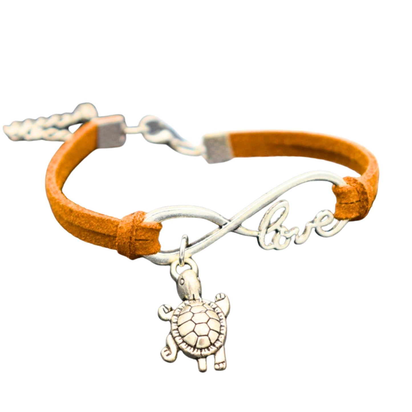 Natural-colored Infinite Love Turtle Bracelet, adjustable and vegan-friendly, featuring a silver turtle charm on a soft faux leather band.