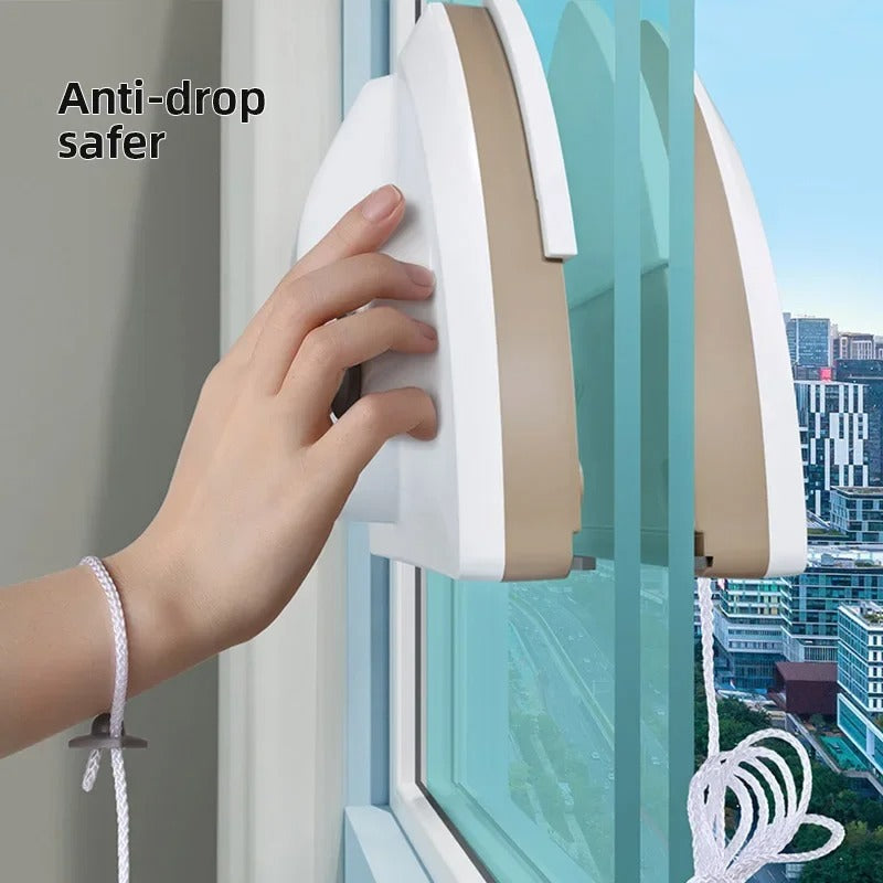 Hand using Magnetic Window Cleaner with safety rope attached for upper windows