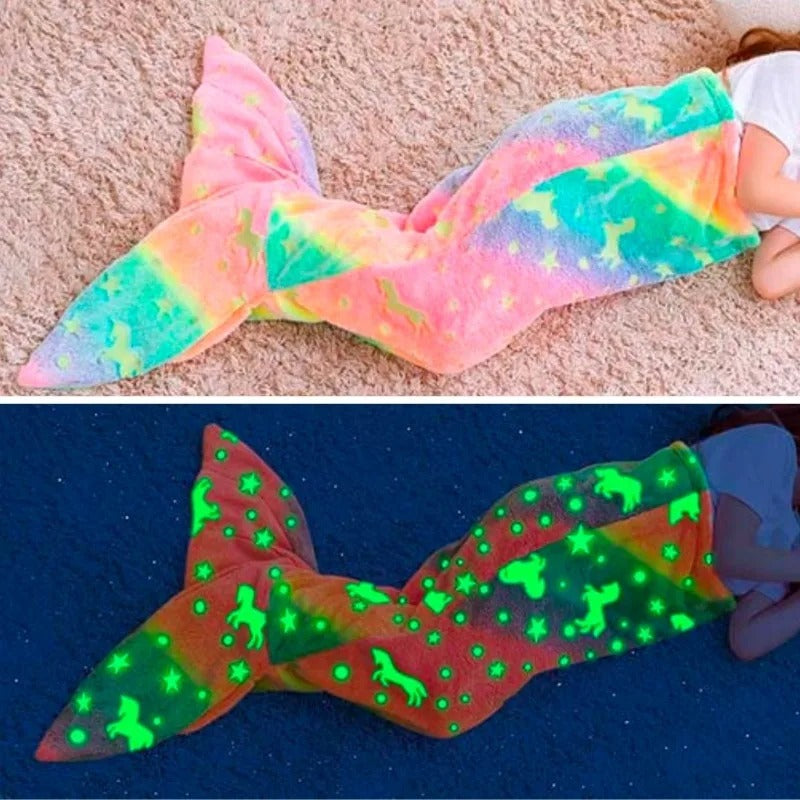 Side-by-side view of Mermaid Galaxy Glow Blanket in daylight and glowing at night