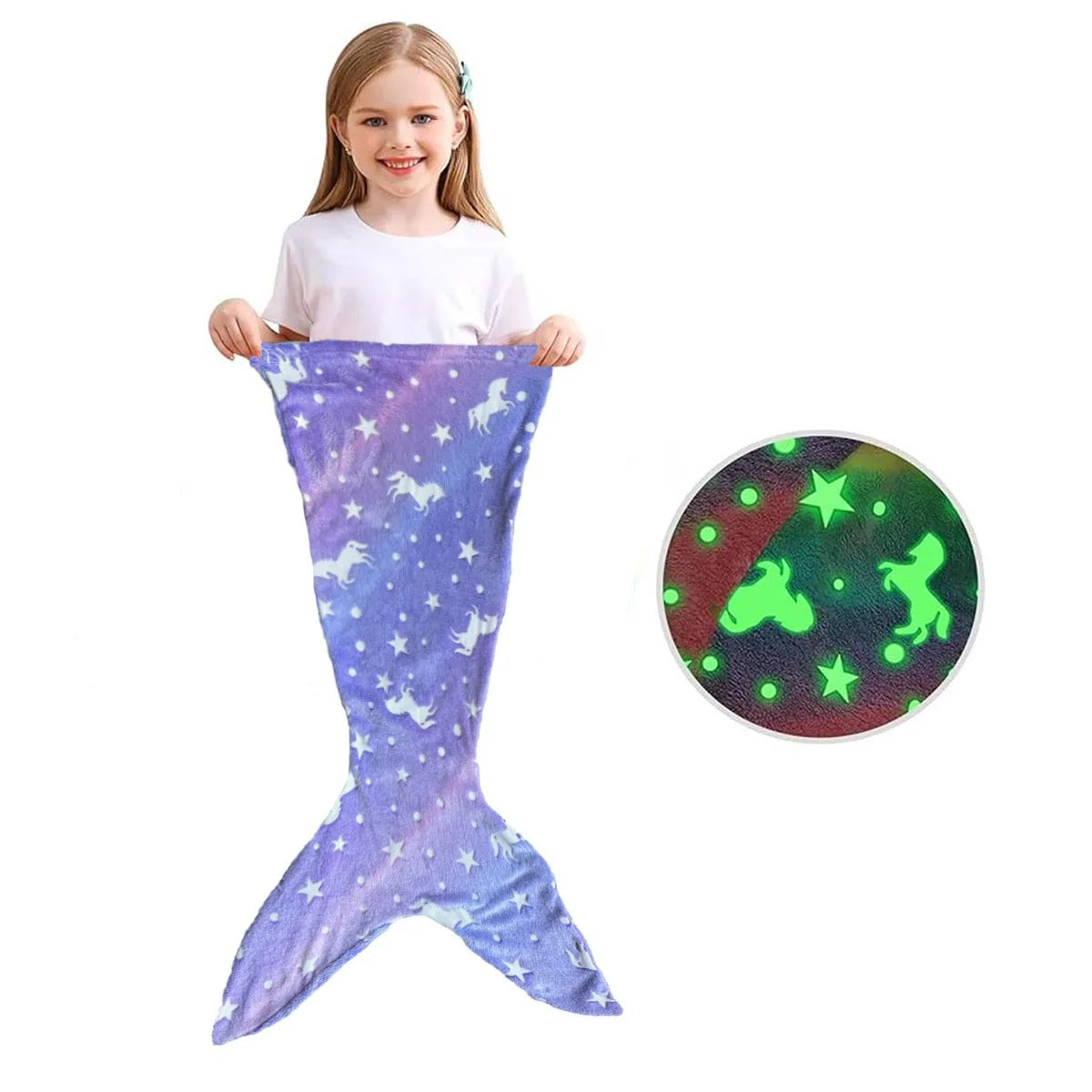 Girl holding purple Mermaid Galaxy Glow Blanket shaped like mermaid tail with unicorn and star pattern