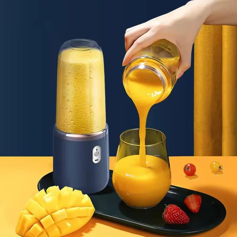 Portable Juicer Blending Mango Smoothie with Fresh Fruits