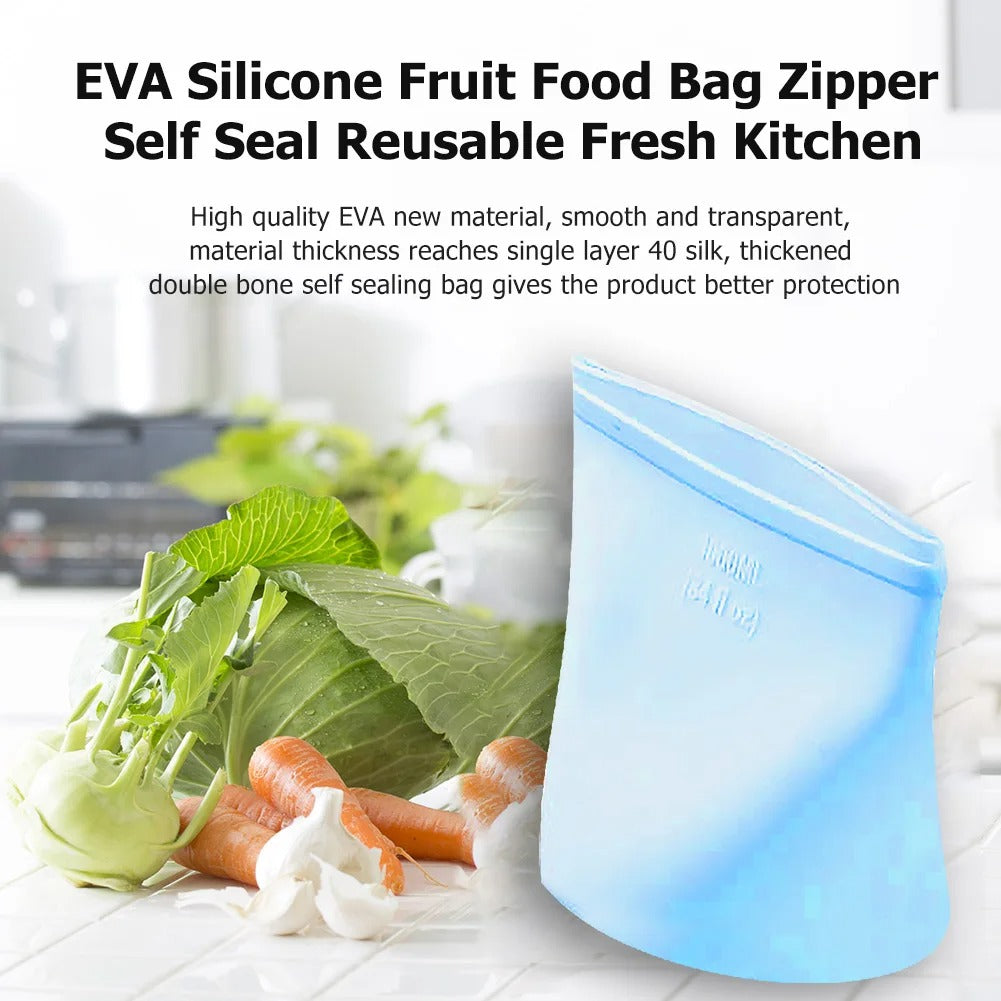 Reusable silicone food bag with carrots and greens on kitchen counter