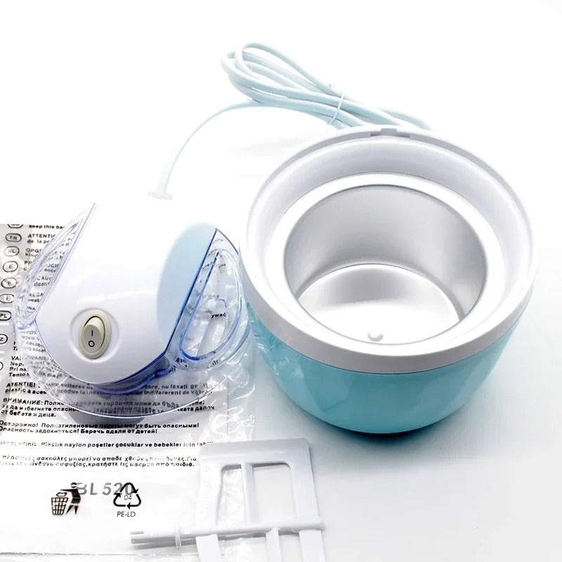 Single-Serve Ice Cream Maker with power unit, removable freezing bowl, paddle, and instructions laid out.