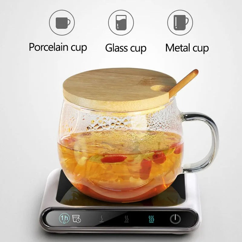 USB mug warmer heating a glass tea cup, showing compatibility with various cup types.