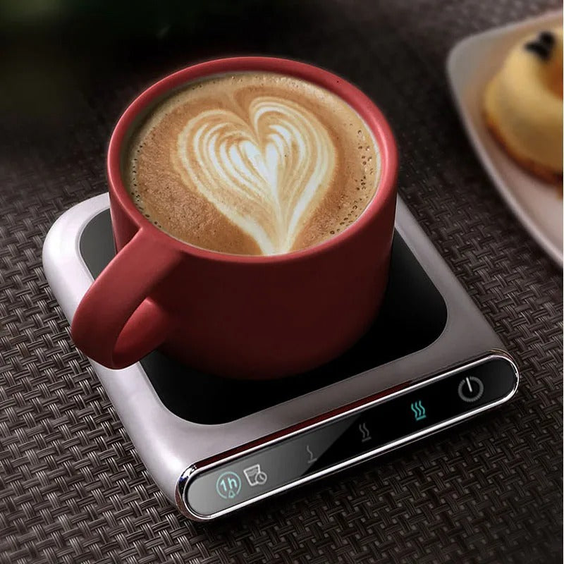 USB smart mug warmer heating a latte in a ceramic mug on a modern desk.
